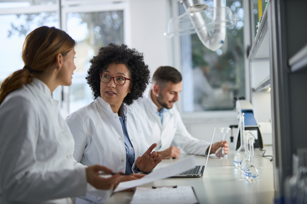 Scientists having a discussion in the lab