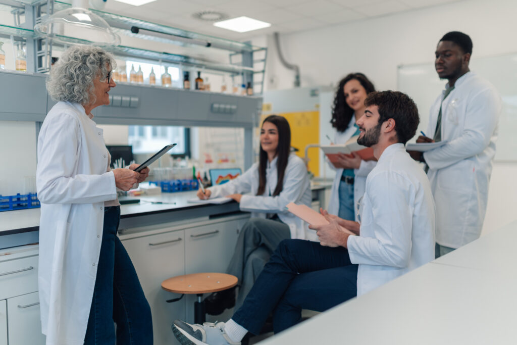 Scientists discussing as a group in the lab